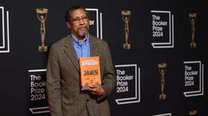 epa11717230 Shortlisted US author Percival Everett holds a copy of his book 'James' at the 2024 Booker Prize ceremony in London, Britain, 12 November 2024.  EPA/ANDY RAIN