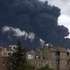 epa12077771 Smoke billows over buildings following Israeli airstrikes in Sana'a, Yemen, 06 May 2025. Israel has carried out a wave of airstrikes on Yemen's capital, Sana'a, a day after striking the port of Hodeidah in response to a Houthi missile that landed near Israel's Ben Gurion airport, Houthi-run Al-Masirah TV has reported.  EPA/YAHYA ARHAB